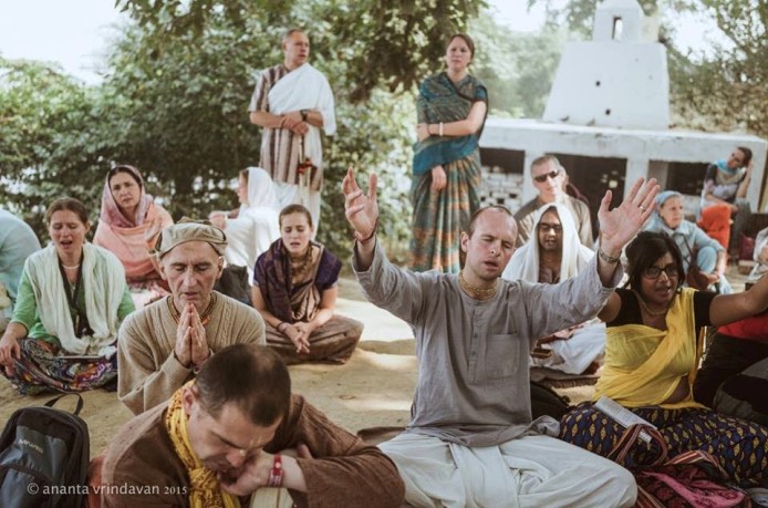 Devotees listening to a class outdoors