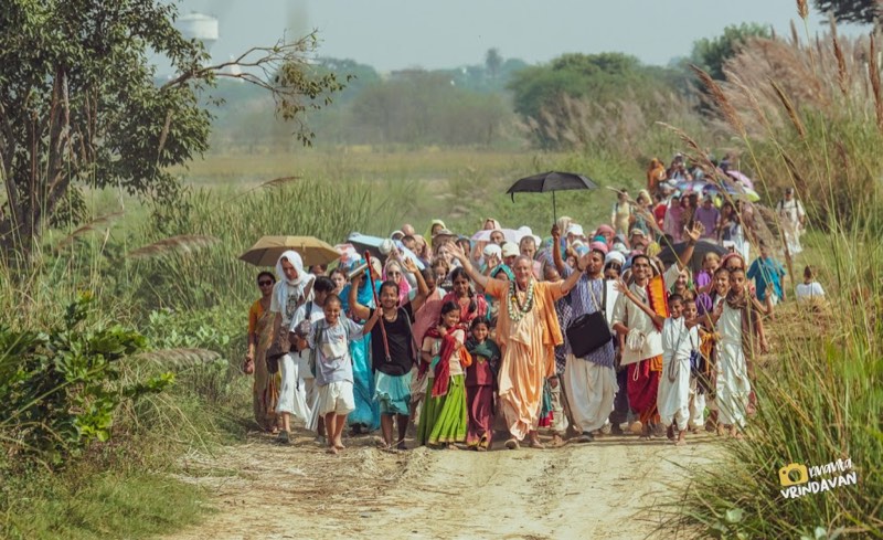 Pilgrims walking through the fields